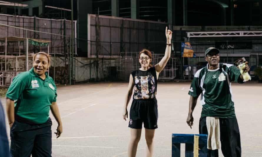 Emma John (centre) at Harvard Cricket Club, Trinidad, playing on a tennis court