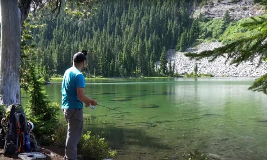 Fishing in a perfect shallow, clear lake for trout.