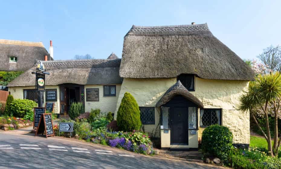 Quaint thatched pub at Maidencombe Beach in South Devon.