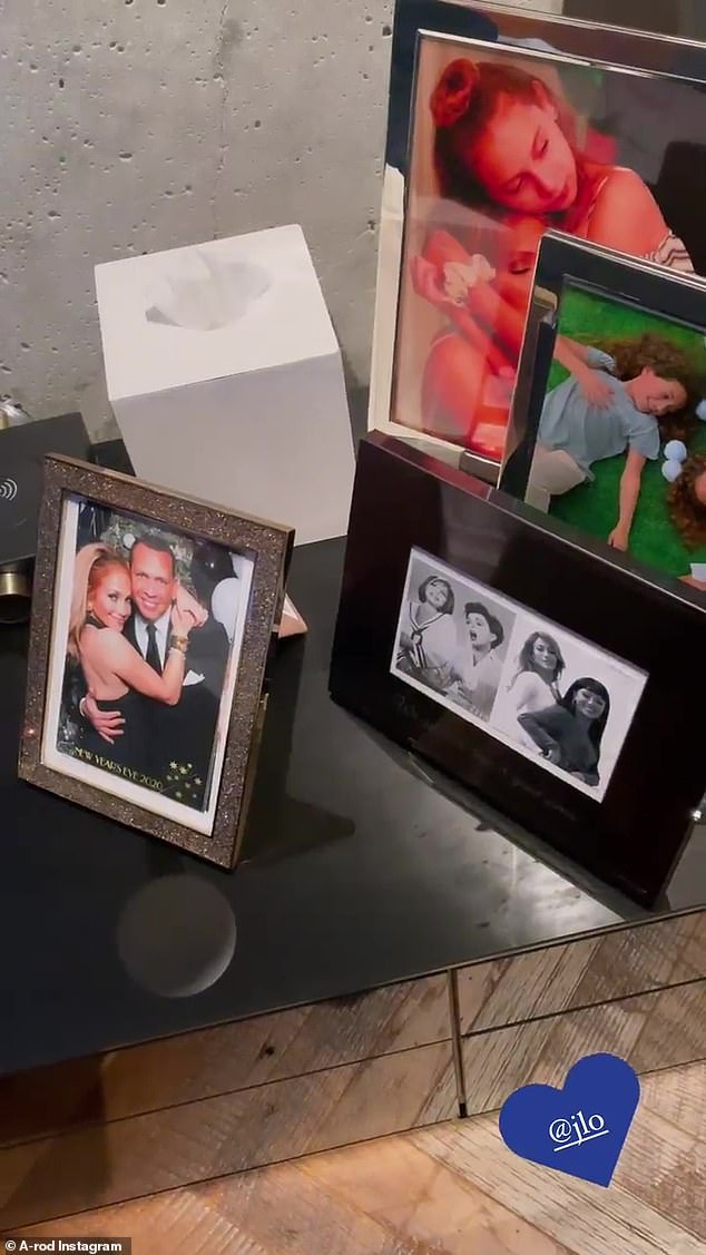 Saying goodbye: The camera panned around to several framed photos of Alex, Jennifer and their blended family - Rodriguez's two girls, Natasha, 16, and Ella, 12, and Lopez's twins Emme and Max, 13