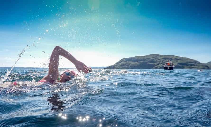 Woman swimming the gulf of Corryvreckan, Inner Hebrides.