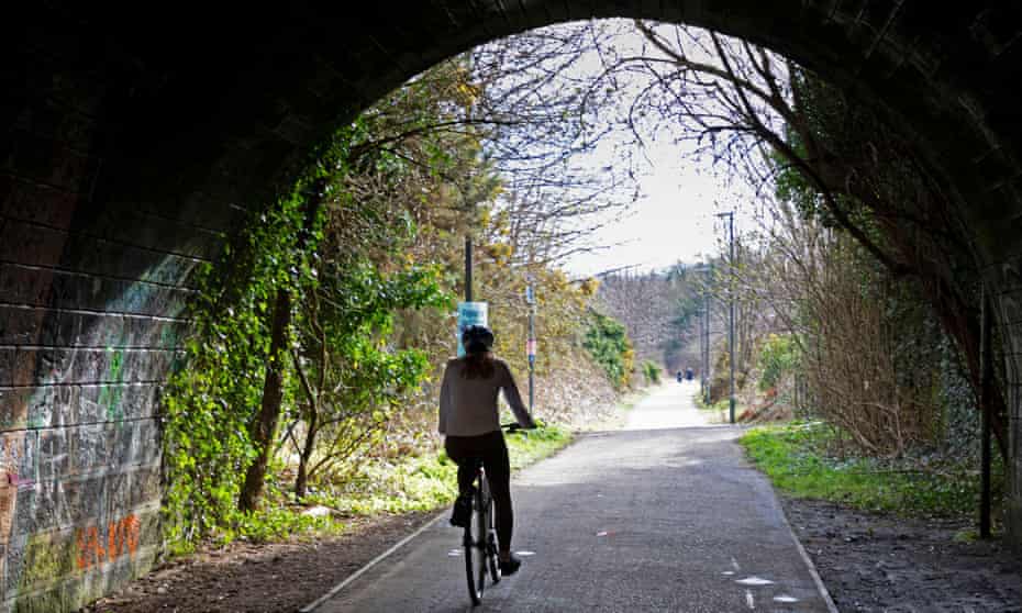 Cyclist on the Innocent Railway path towards Portobello from central Edinburgh.