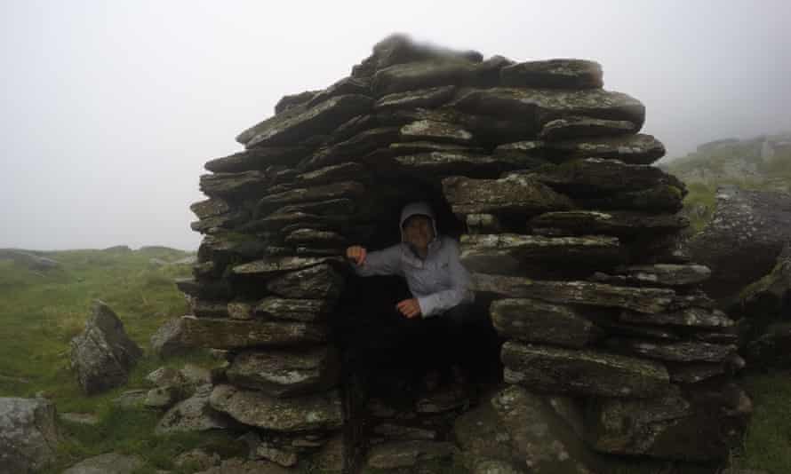 A stony shelter in a rainstorm.