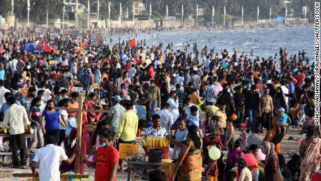 People enjoy warm weather at Juhu Beach in Mumbai, India, on April 4. 