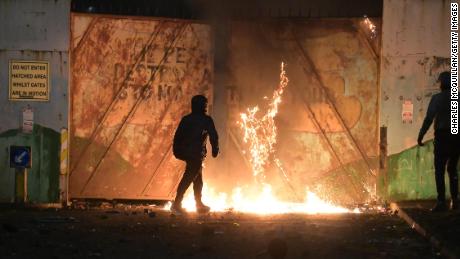 Fire fed by petrol burns as youths clashed at the Peace Gate at the Springfield Road/Lanark Way interface on April 7 in Belfast, Northern Ireland. 