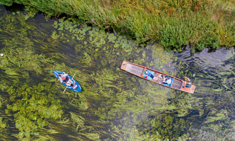 A punt and canoe on the River Cam by Grantchester Meadows.