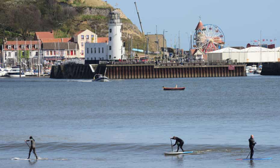 Paddleboarders in Scarborough, North Yorkshire, UK.