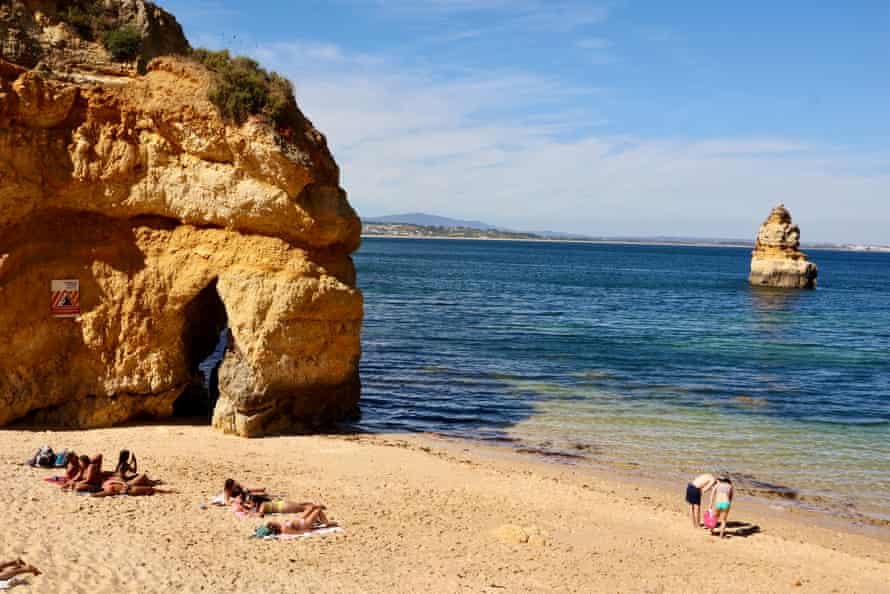 Sunbathing at Praia do Camilo