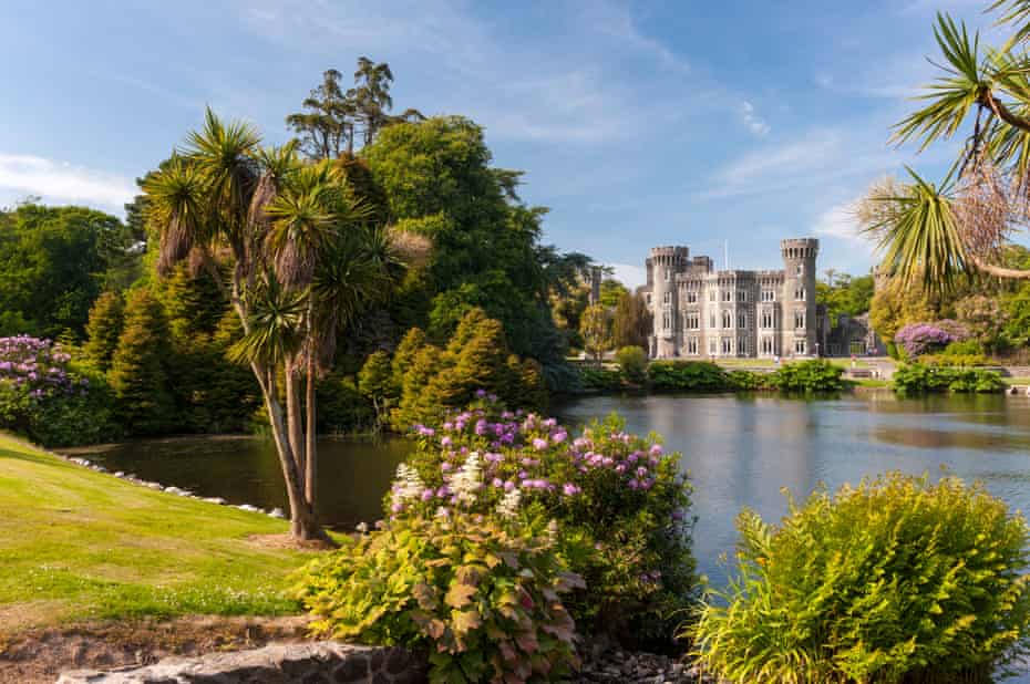 View across a lake to Johnstown Castle, County Wexford, Ireland.