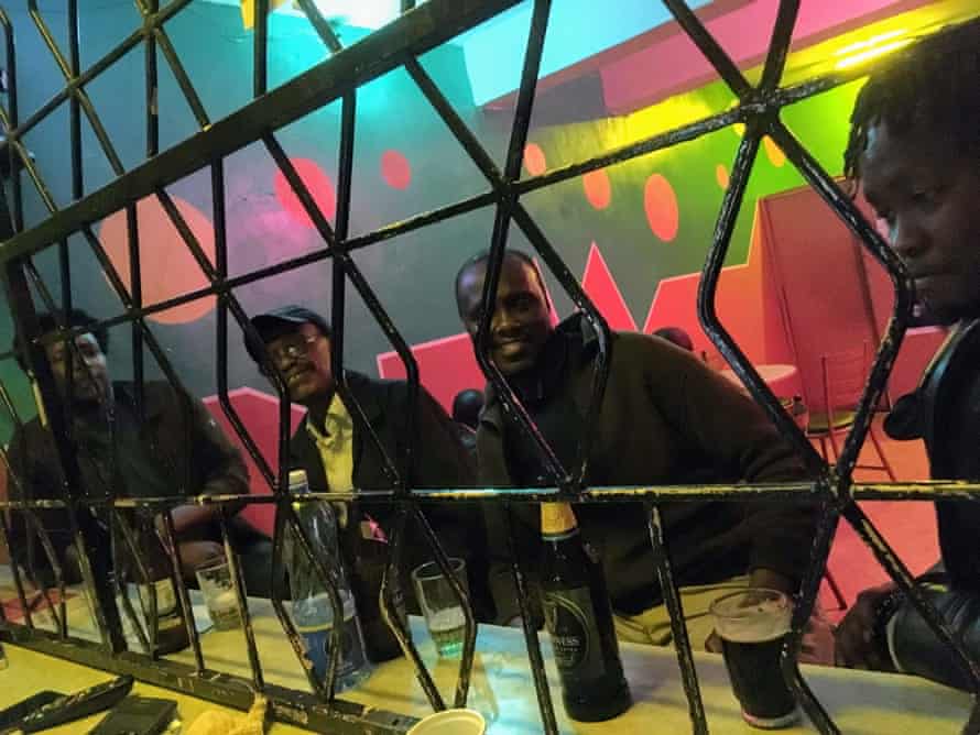 My brother, Tee Ngugi, second from right, with friends at Wakari’s bar and restaurant by Limuru market, Kenya.