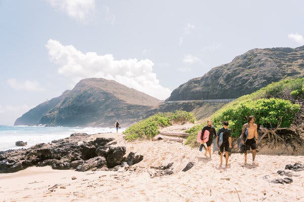 Bodyboarders in Makapu’u, Hawaii, in March. Currently, to visit the islands or move between them, travelers have to show a negative coronavirus test taken within 72 hours.