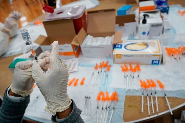 Preparing Johnson &amp; Johnson coronavirus vaccine in Staten Island in April.