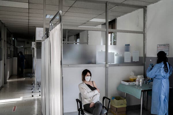 Administering the AstraZeneca vaccine at the military hospital in Milan in March. The country will stop distributing the vaccine to people below the age of 60.