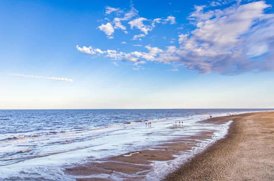 Beach, Skegness, UK, on a sunny, blue-sky day.