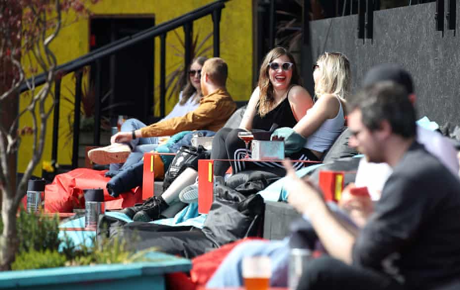 Customers enjoy a drink at the Escape to Freight Island bar in Depot Island, Manchester