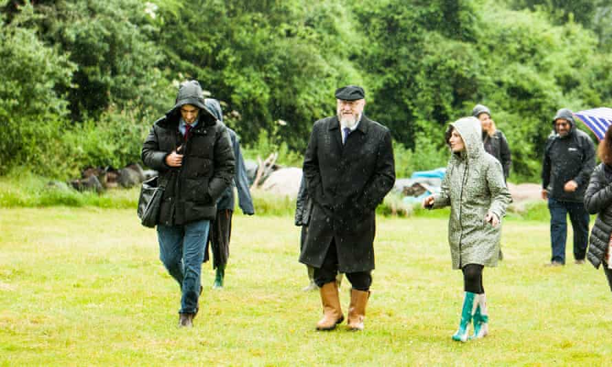 Naomi Verber, who designed and runs the hotel (right) showing Ephraim Mirvi, the chief rabbi (centre), around the farm.