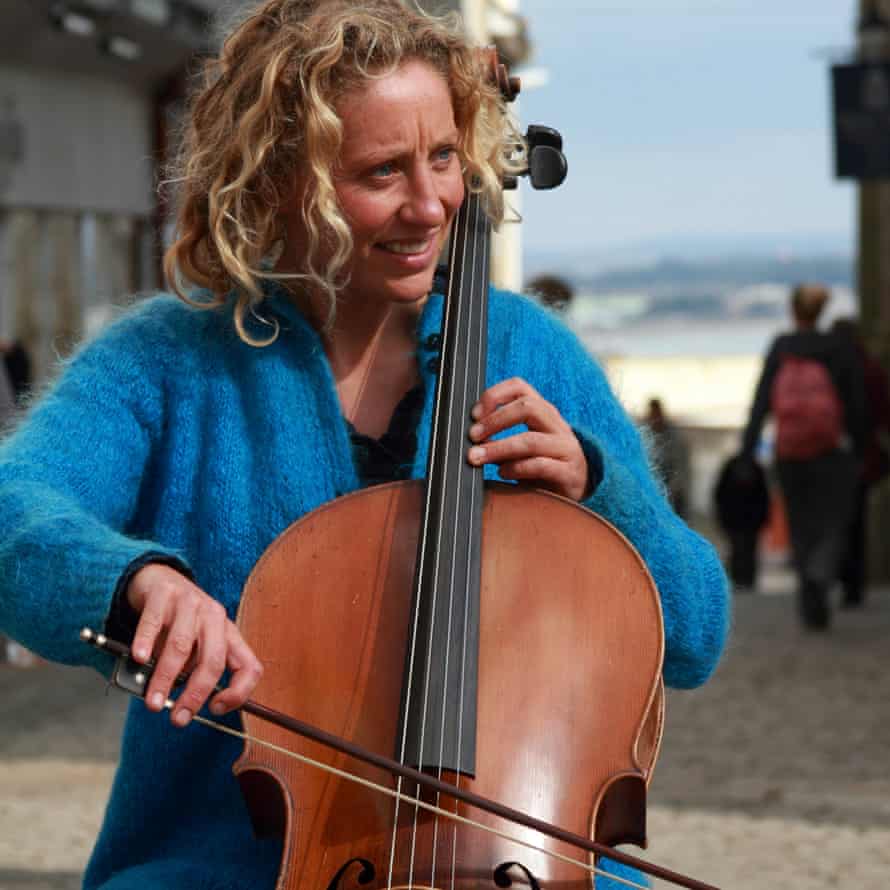 Catrina Davies busking with here cello.