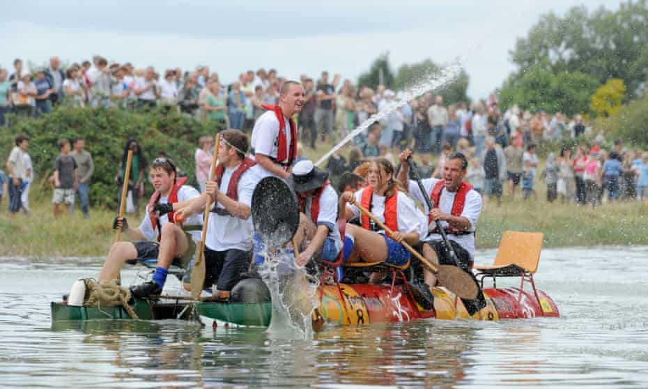 Competitors race downriver from Lewes to Newhaven on homemade craft.