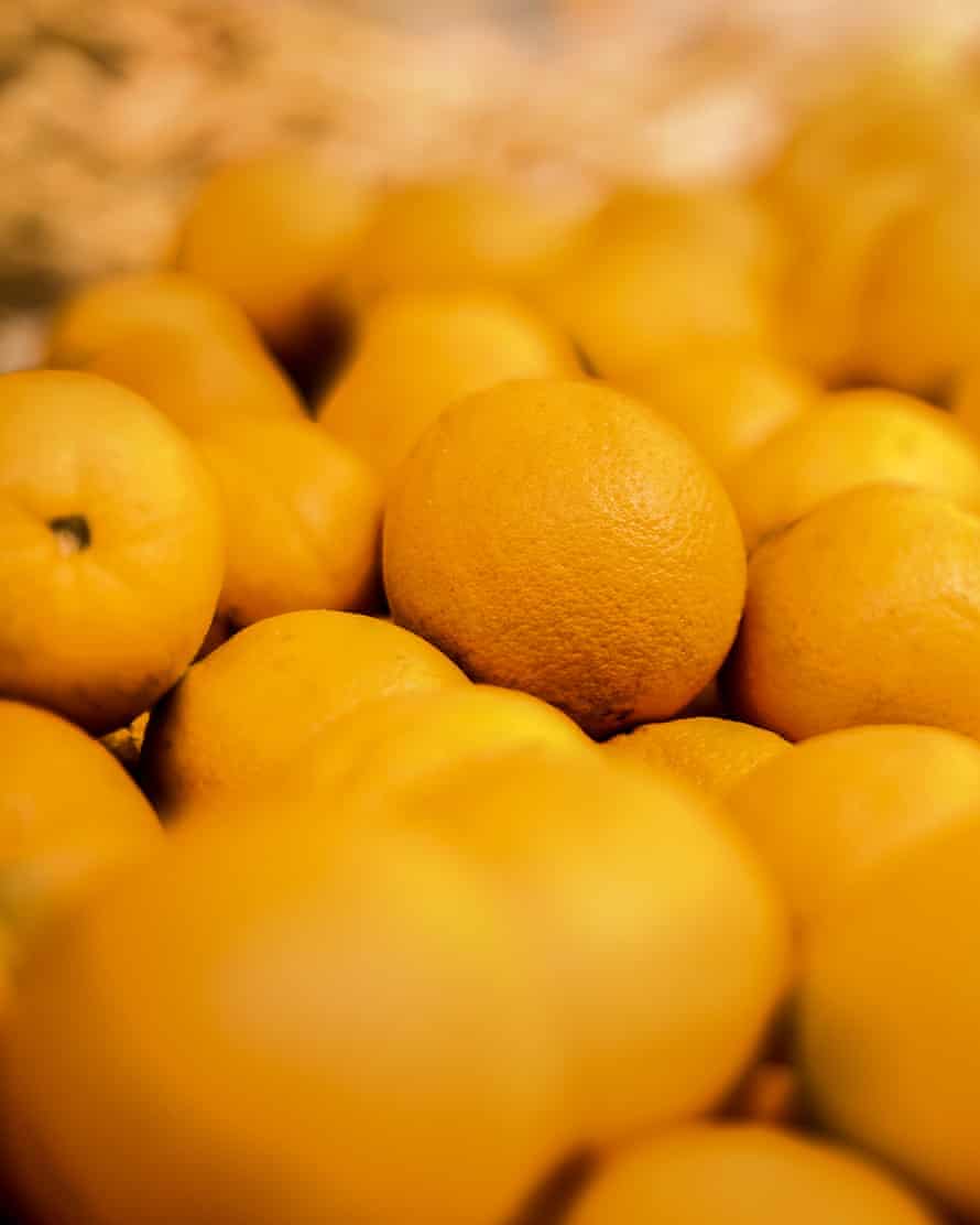 Pile of tasty orange tangerines at a local farmer’s market in Funchal, Madeira.