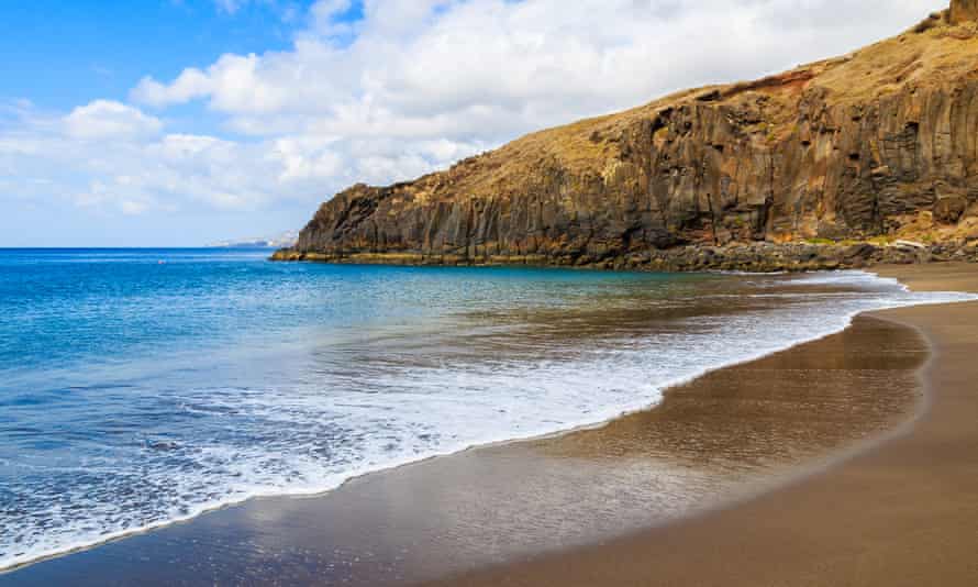 Ocean wave on beautiful Prainha beach with golden sand, Madeira island, Portugal