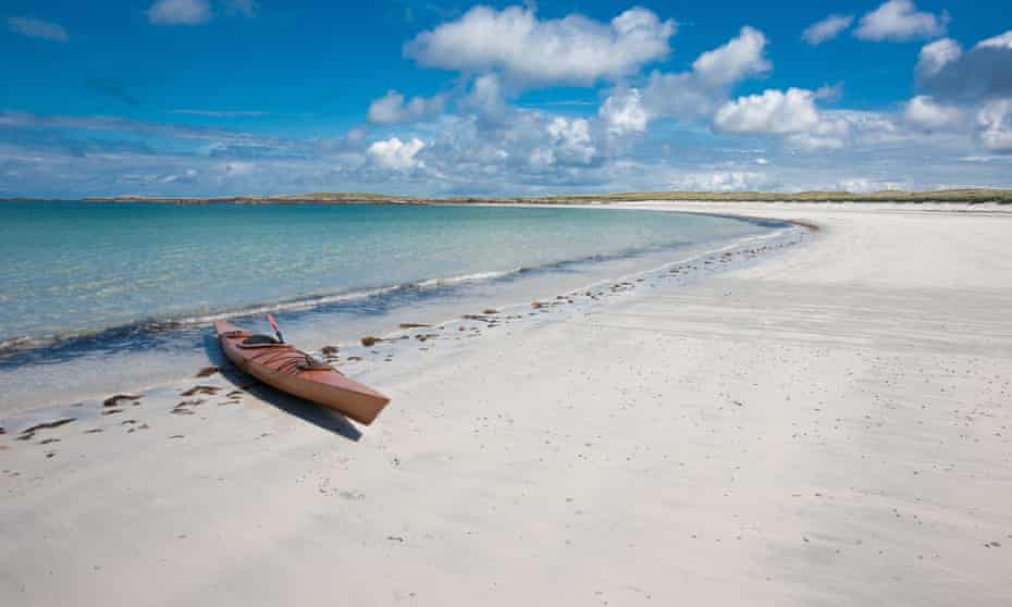 empty white beach with kayak