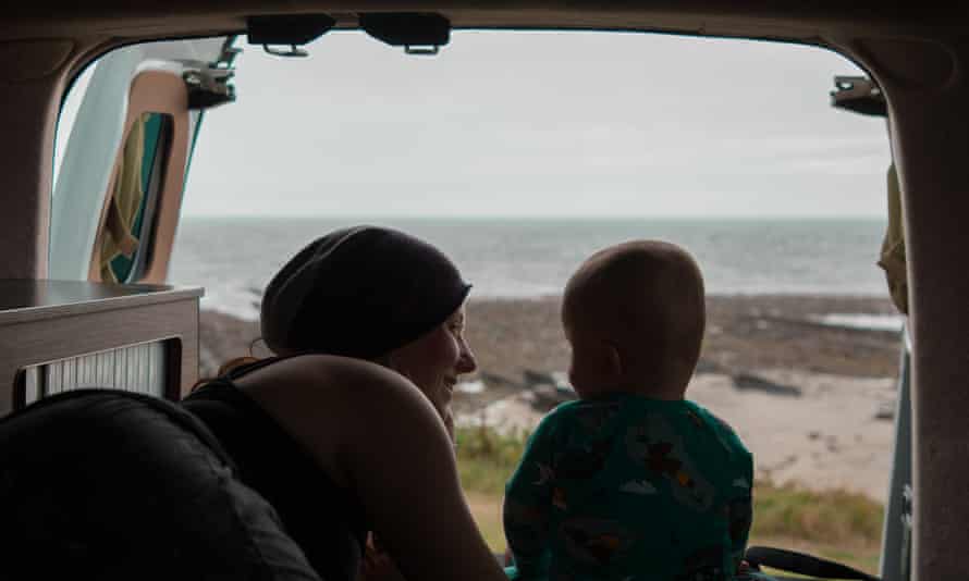 The author and her son enjoy seaside views from the van.