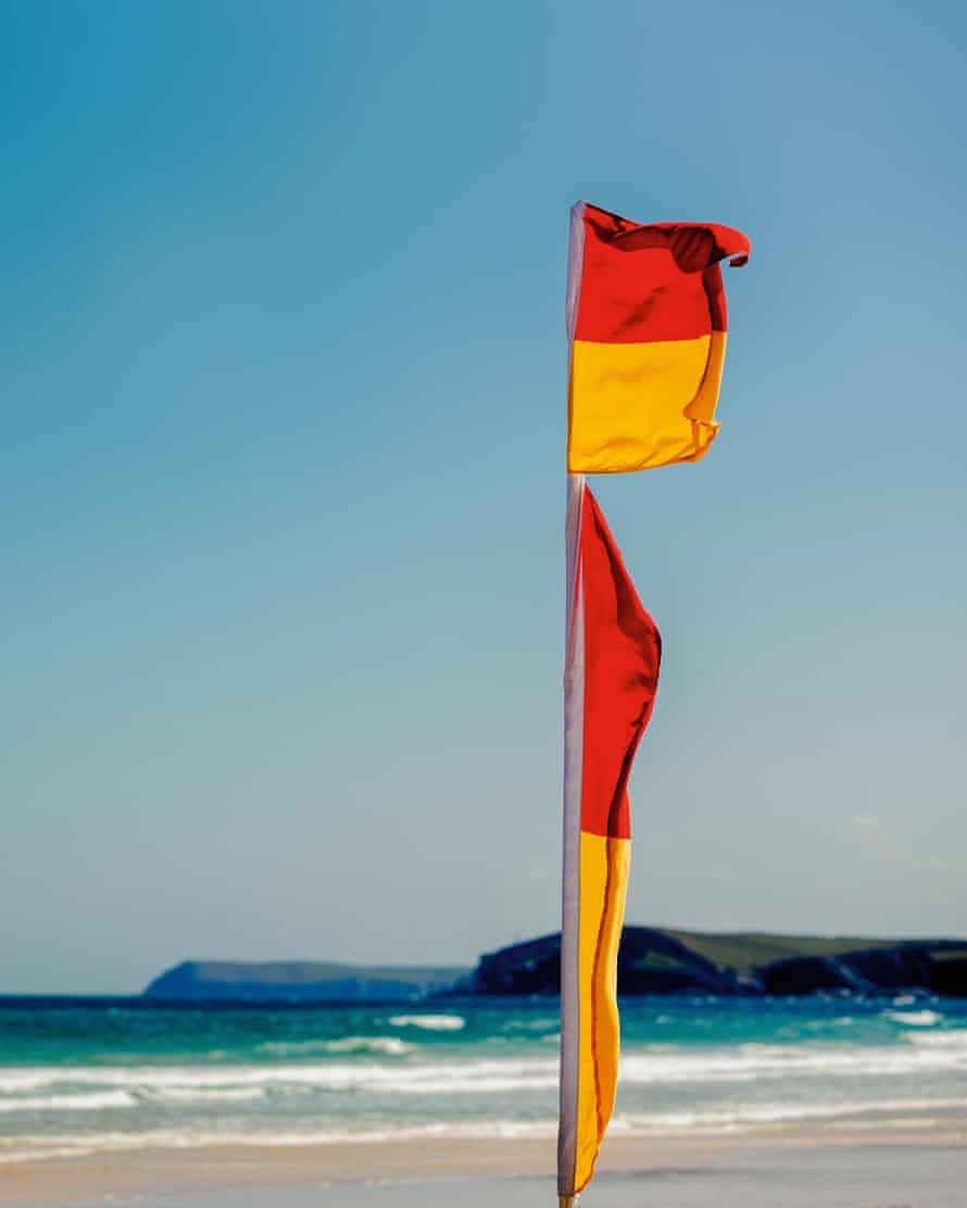 A flag indicating the safe zone on the beach