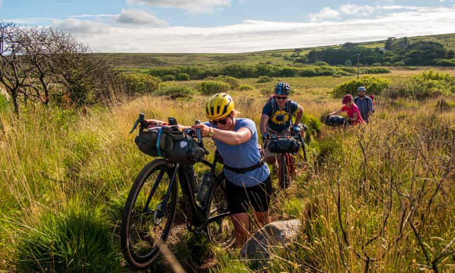 Katherine Moore (Unpaved podcast), Rob Penn (freelance journalist), Sophie Gordon (Cycling UK) and Stefan Amato (Pannier) push their bikes along a difficult overgrown bit of singletrack across the Penwith Moors during a recce ride of Cycling UK’s West Kernow Way, June 2021. The 230km route is part of the EU-funded EXPERIENCE project to develop sustainable year-round tourism activities in Cornwall.