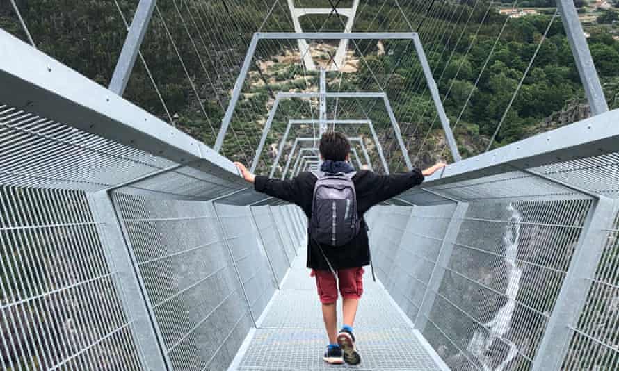 Oliver Balch younger son walking over the new bridge.