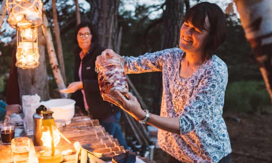 woman holding up pickled herring