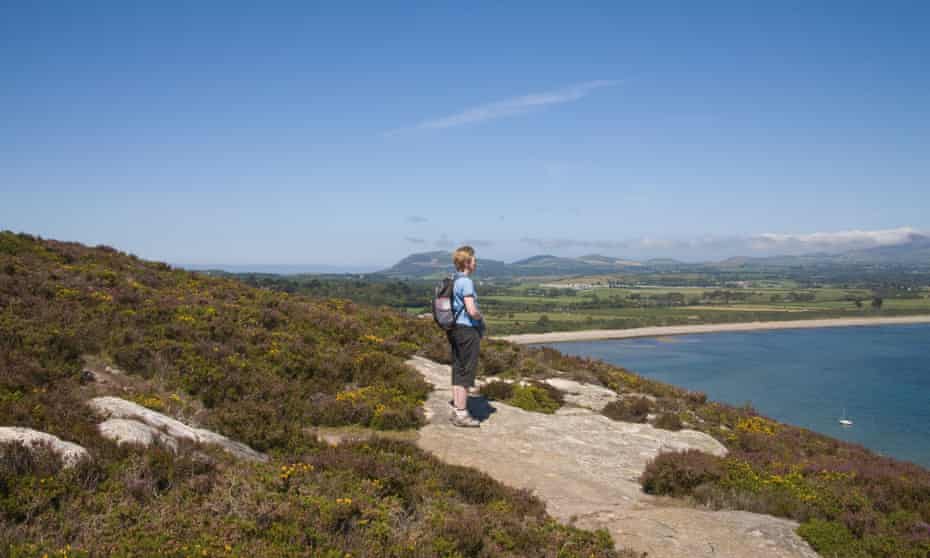 A hiker on the coastal path near Llanbedrog.