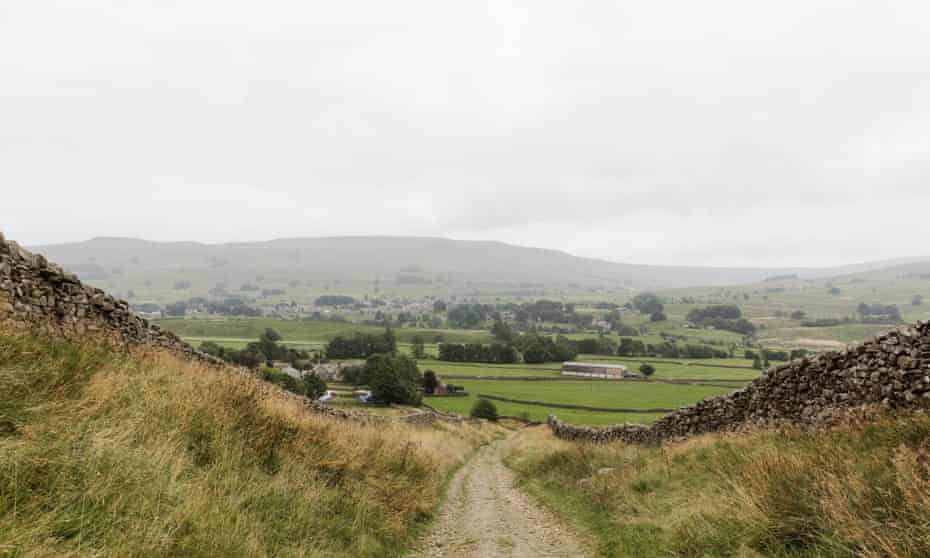 Walking down from Great Shunner Fell, with Wether Fell in the distance.