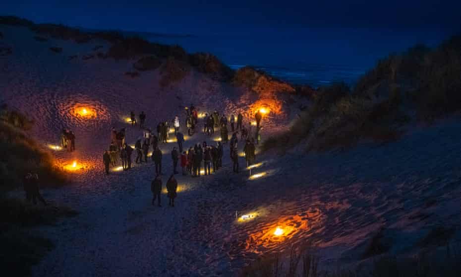 Guests on the beach for Over Lunan, Scotland.