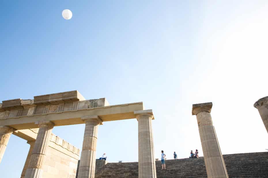 Tourists visiting an archeological site in Lindos, Rhodes.