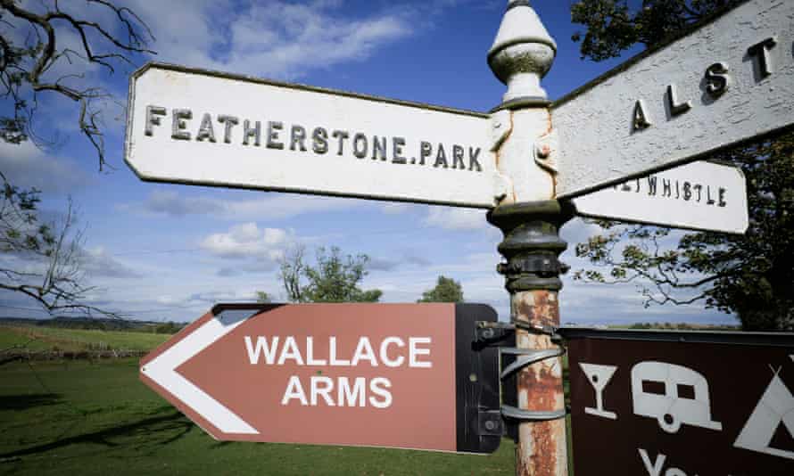 Sign pointing to Wallace Arms