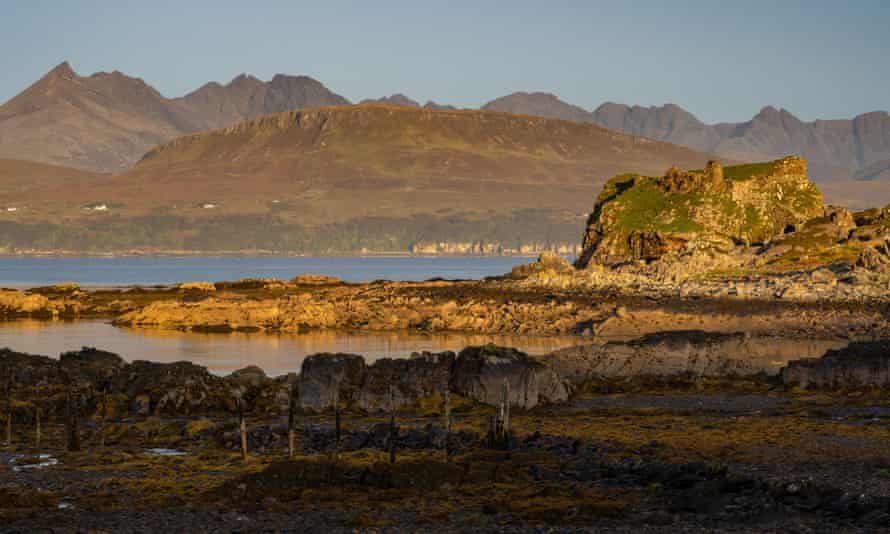 Dunscaith Castle with the Cuillins in the background.