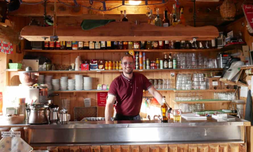 Kevin Siorpaes at the bar in Rifugio Nuvolau, which his family ran for 47 years until 2020.