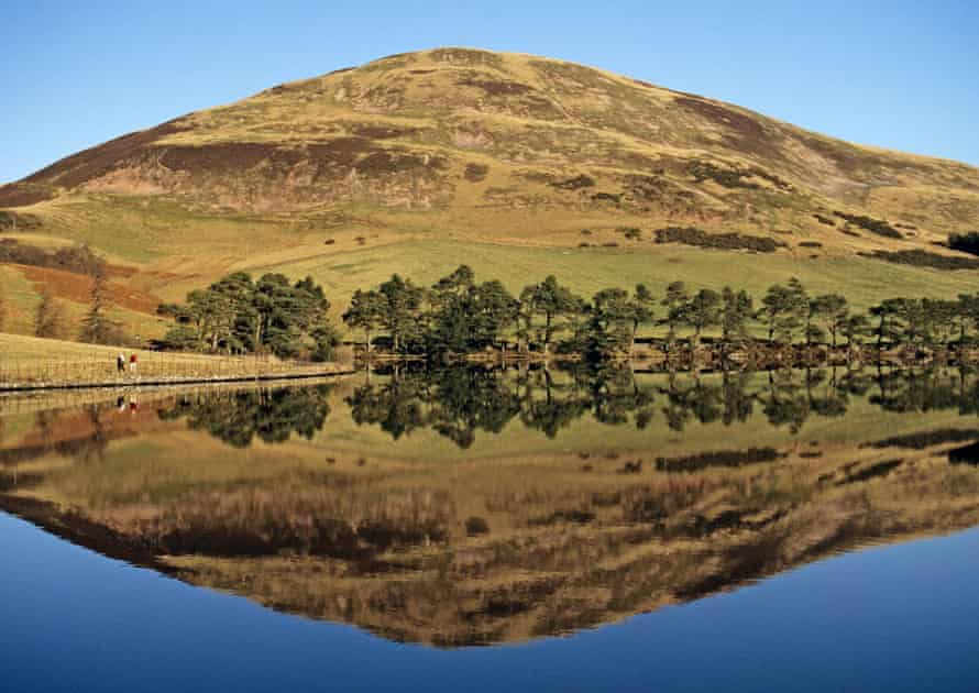 Walkers passing Glencorse Reservoir