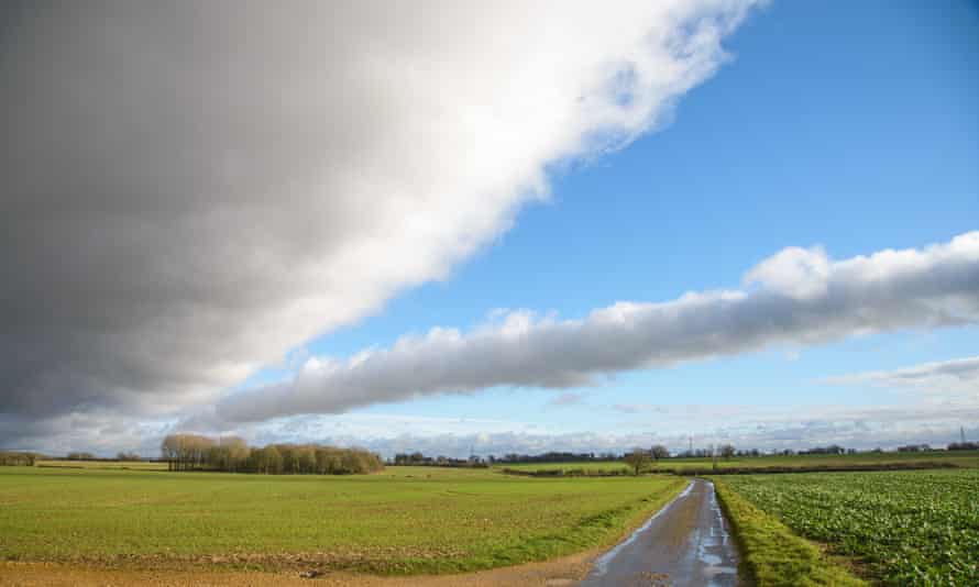 ‘Raynhams’ walk Norfolk. Sculthorpe Mill pub, Sculthorpe, Norfolk. Big skies on the path/road from East Raynham.